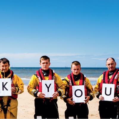 Read more about the article RNLI thanks fundraising crew of estate agents
